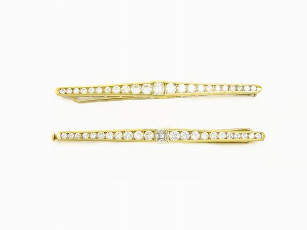 Pair of yellow gold bar brooches with diamonds