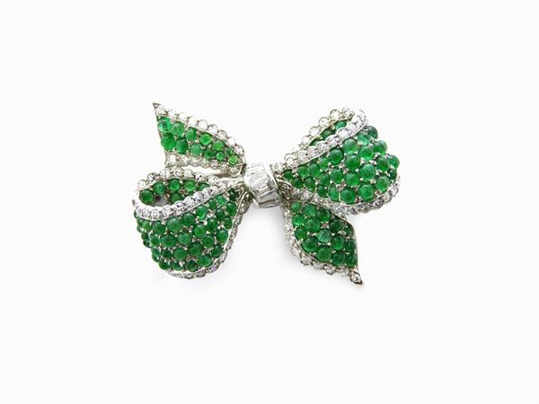 Platinum brooch with diamonds and emeralds