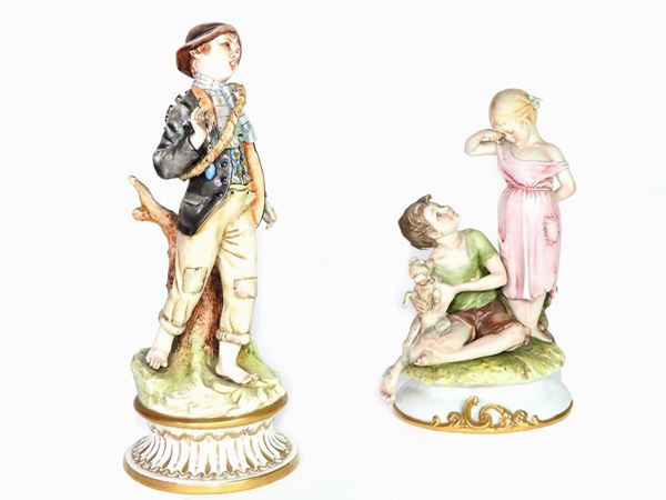 Two Polychrome Porcelain and Bisque Figural Groups