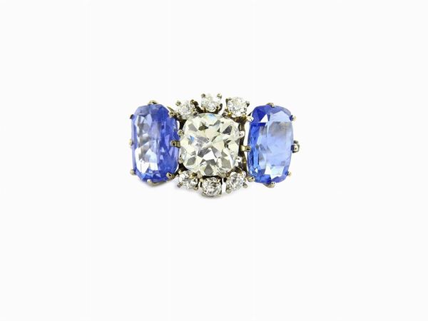Platinum trilogy ring with diamonds and natural sapphires