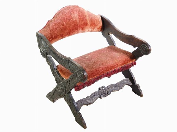 An Ebonised Wooden Low Armchair
