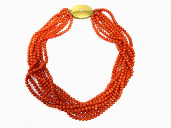 Seven strands red coral necklace with yellow gold and diamond clasp