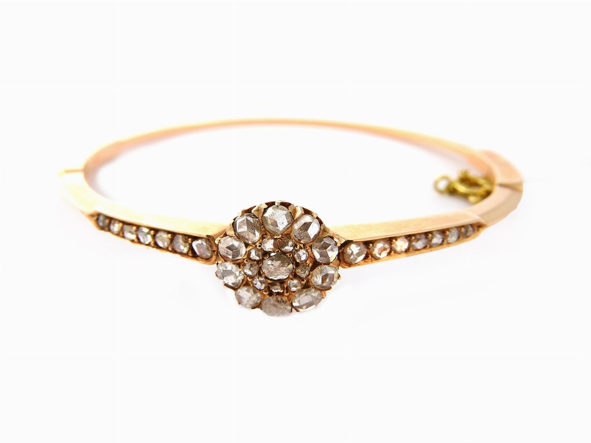Due Bracciali Rigidi in Oro Giallo con Diamanti e Rubini