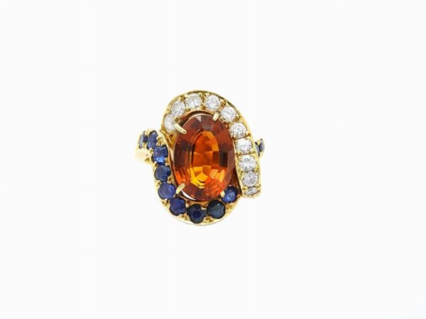 Yellow gold ring with diamonds, sapphires and madeira quartz