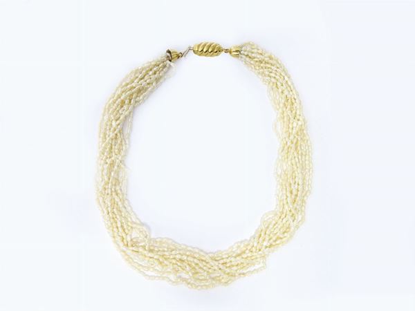 Cultured freshwater rice grains pearls necklace with yellow gold clasp