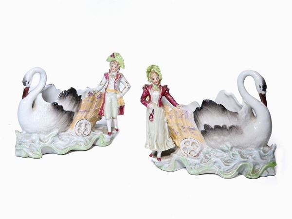 A Pair of Polychrome Porcelain Figural Flower Vases