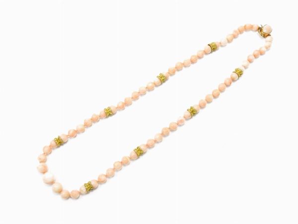 Graduated pink coral necklace with yellow gold spacers and clasp