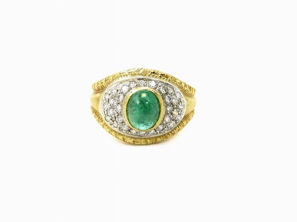 White and yellow gold ring with diamonds and emerald
