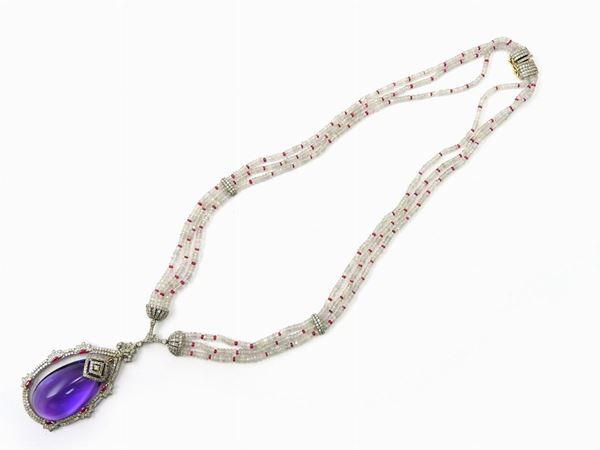 14KT yellow and white gold necklace with diamonds, colourless corundums, rubies and amethyst quartz