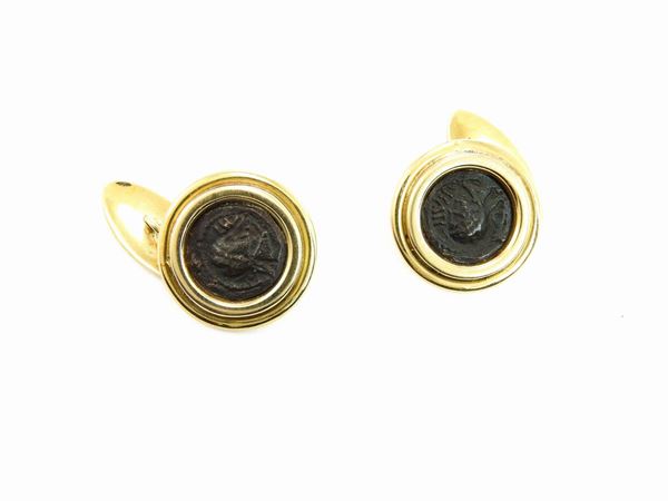 Yellow gold cuff links with ancient coins