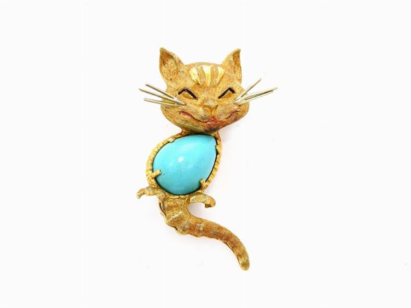 Yellow gold animalier-shaped brooch with stabilized turquoise