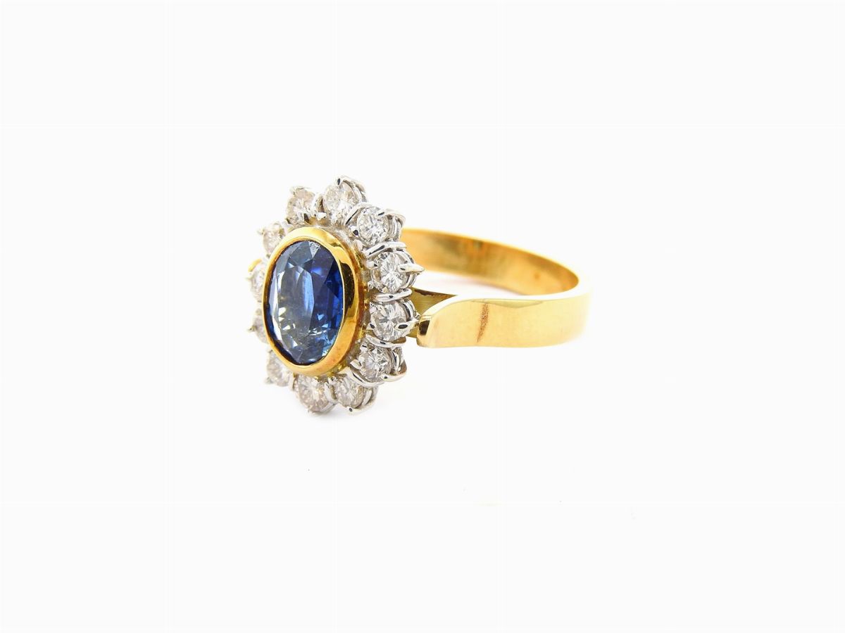 Anello a Margherita in Oro Giallo e Bianco con Diamanti e Zaffiro