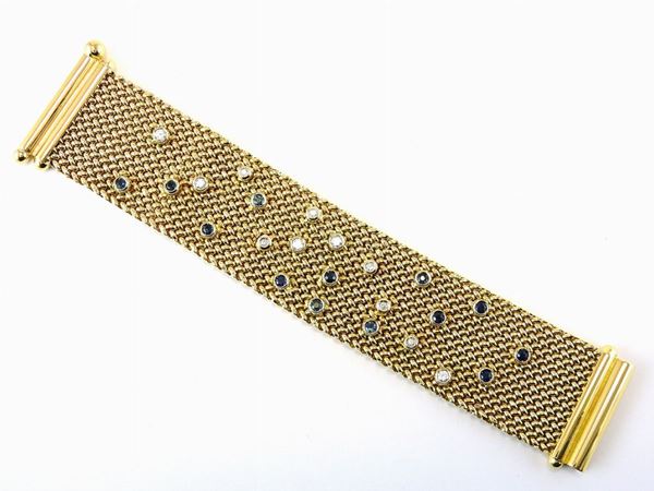 Yellow gold woven texture bracelet with diamonds and sapphires