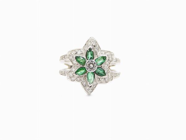 White gold ring with diamonds and emeralds
