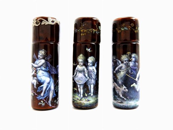 Five metal perfume holders with multicoloured enamels