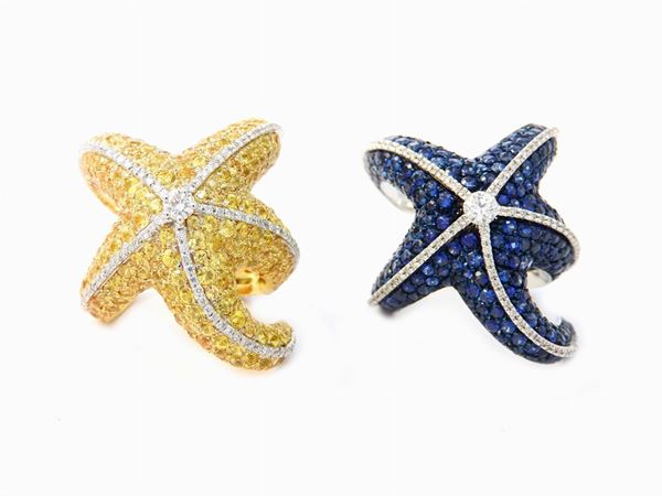 Pair of white and yellow gold animalier-shaped rings with diamonds and blue and yellow sapphires