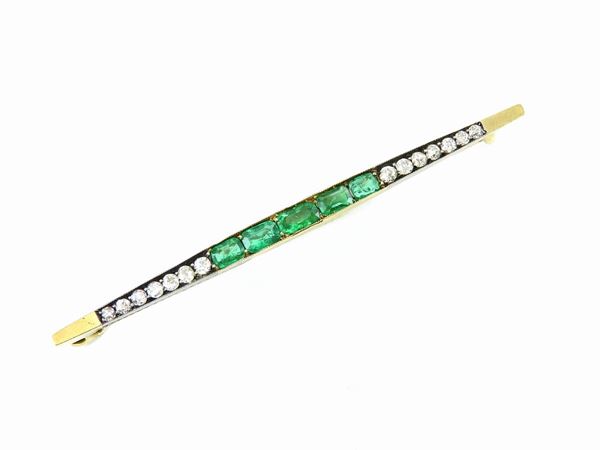 Yellow gold bar brooch with diamonds and emeralds