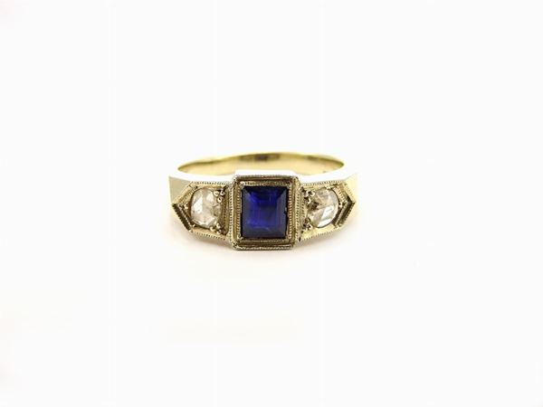 White gold men ring with diamonds and sapphire