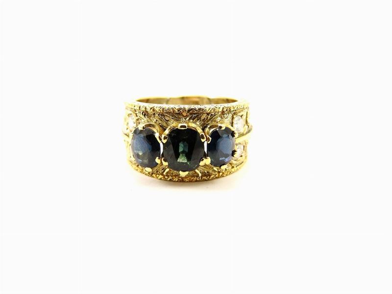 Anello a Fascia in Oro Giallo Favilli con Diamanti e Zaffiri
