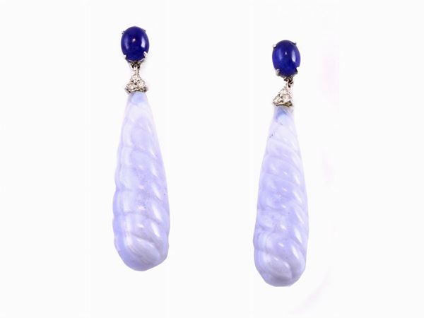 White gold ear pendants with enhanced sapphires and light blue calcedony