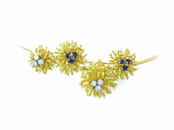 Yellow gold brooch with diamonds and sapphires