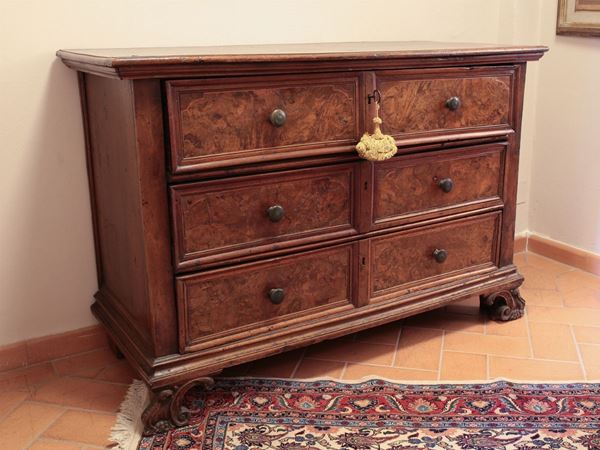 A burr walnut veneered chest of drawers