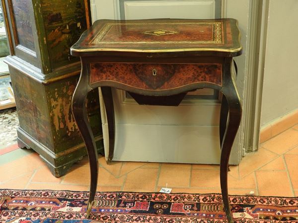 A Burr and Ebonised Wooden Work Table