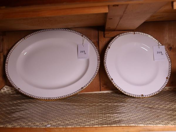 Serie di dodici piatti in porcellana
