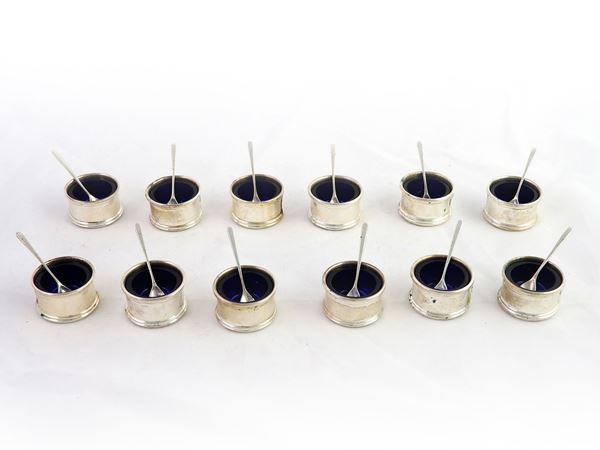 A Group of Silver And Blue Glass Salt Shaker Set