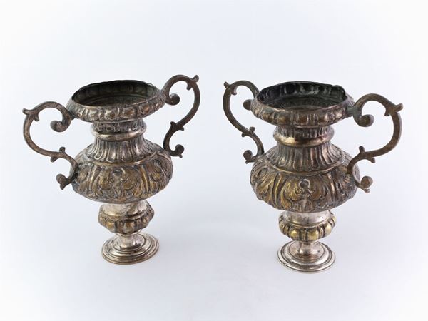 A couple of silver plated vases