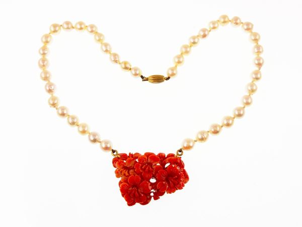 Cultured pearls choker with orange coral panel and yellow gold clasp