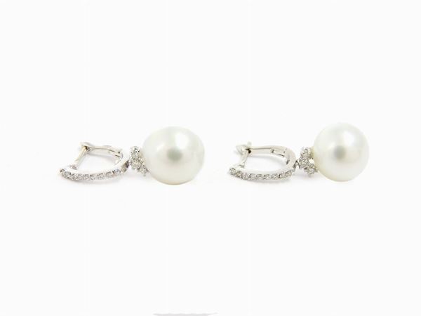 White gold ear pendants with diamonds and cultured pearls