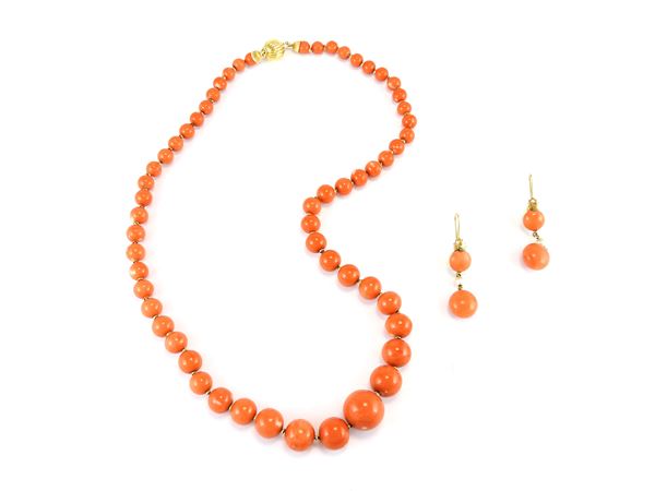 Yellow gold graduated necklace, earrings and ring with diamonds, orange coral, pearls and emeralds