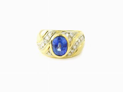 Anello a Fascia in Oro Giallo con Diamanti e Zaffiro