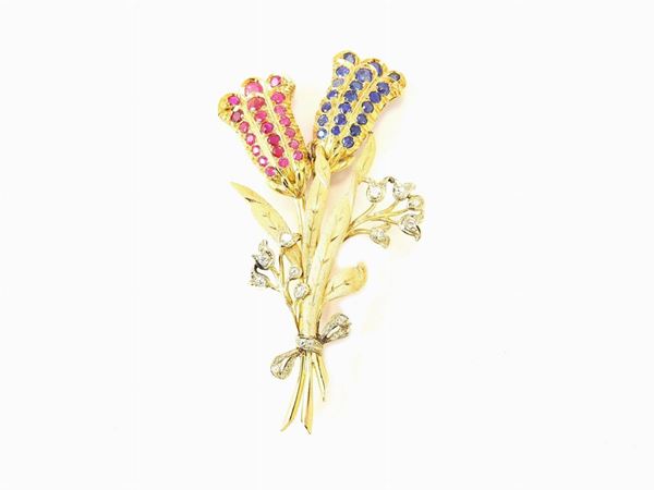 Yellow gold brooch with diamonds, rubies and sapphires