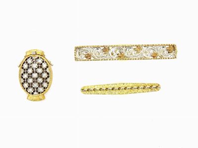 Due Fermacravatta ed una Fermezza in Oro Giallo e Bianco con Diamanti