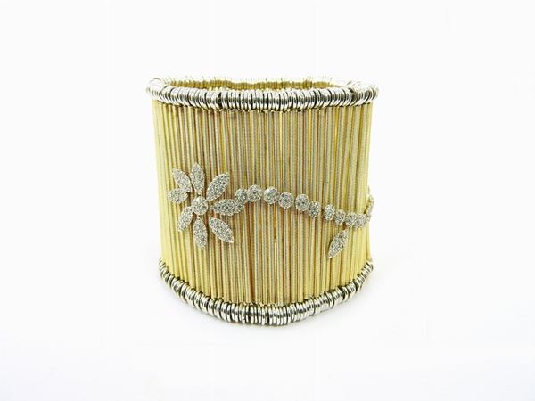 White and yellow gold stretchable band bracelet with diamonds