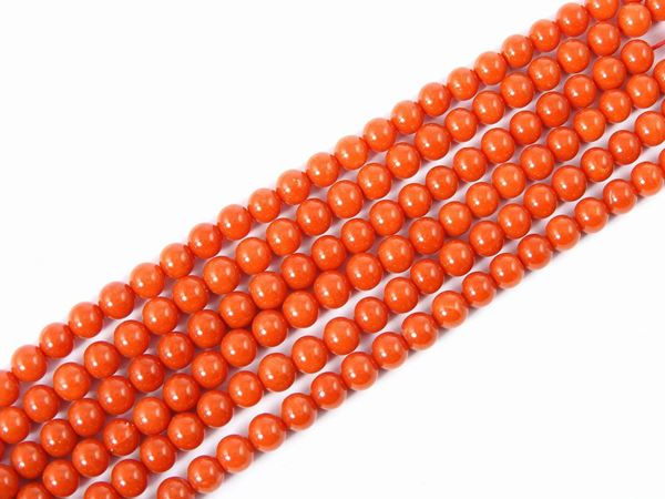 Three red coral strands