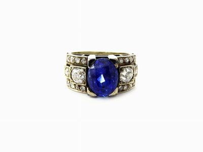 Anello a Fascia in Oro Bianco con Diamanti e Zaffiro Naturale