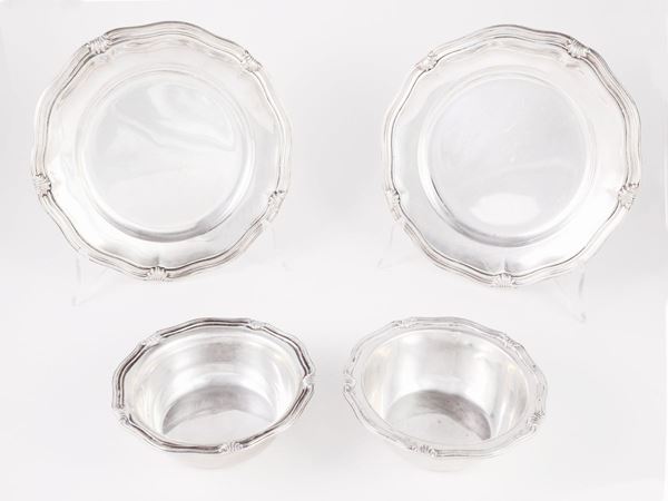 A group of six plates and eight silver cups