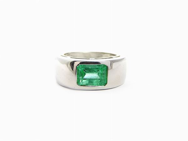 Platinum band ring with emerald