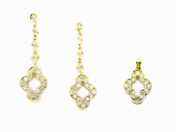 Demi parure of yellow gold ear pendants and pendant with diamonds