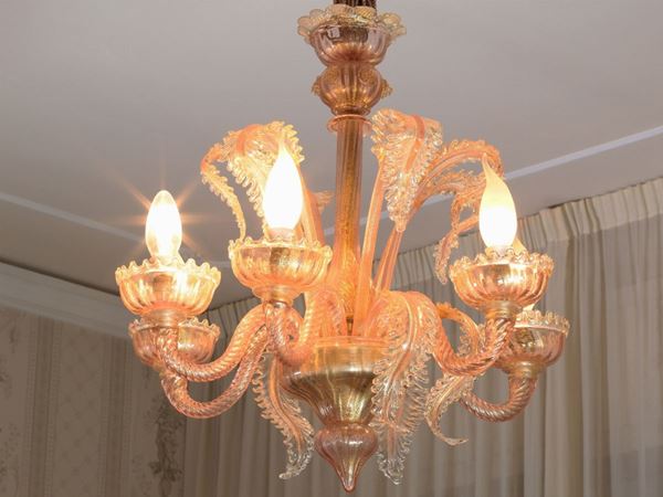 An iridescent Murano glass chandelier and appliques
