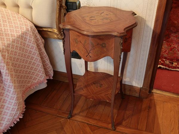 A couple of walnut and other woods bedside tables