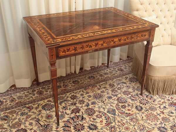 A rosewood veenered table
