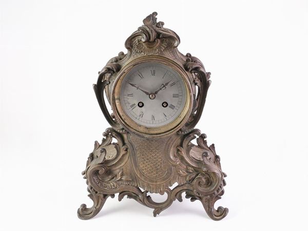 A bronze table clock  (begin of 20th century)  - Auction Furniture, silverware,  old master paintings and curiosity - Maison Bibelot - Casa d'Aste Firenze - Milano