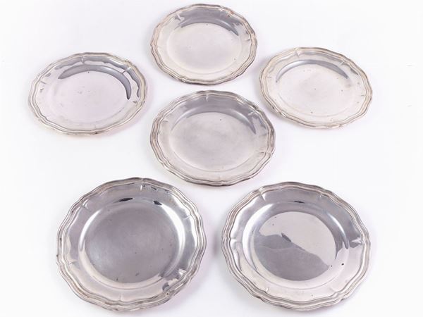 A group of six silver bread plates