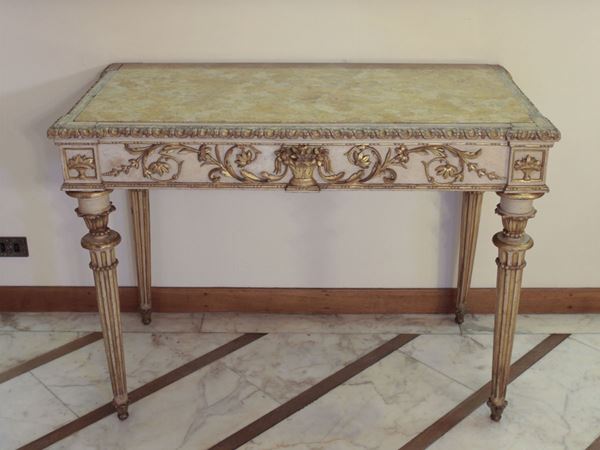 A lacquered and gilded wood console