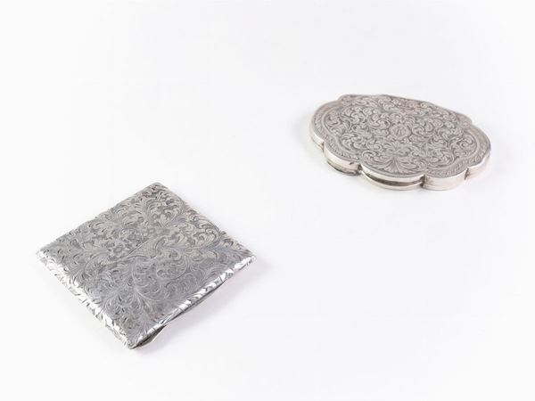 Two silver powder compacts