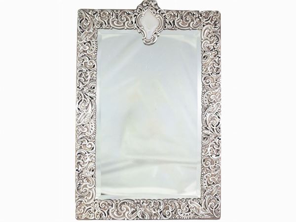 A silver framed mirror